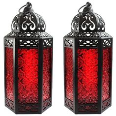 two red glass lanterns sitting next to each other