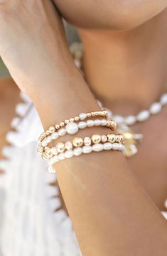 Stack on the shine with this party-ready bracelet set illuminated by cultured freshwater pearls and 18-karat gold-plated beads. Set includes four bracelets Pearl size: 4-6mm Cultured freshwater pearl/18k-gold plate Imported Pearl Bracelet With Spacer Beads, Festive Gold Pearl Bracelets, Festive Gold Pearl Bracelet, White Stackable Pearl Bracelet, Stackable White Pearl Bracelet, White Pearl Bracelets For Festive Occasions, Pearl Bracelets With Spacer Beads, Gold Beaded Spiritual Pearl Bracelet, Festive White Pearl Bracelets