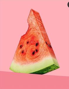 a slice of watermelon on a pink background