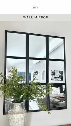 a potted plant sitting on top of a wooden table in front of a window