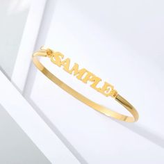 Lets make our lives more beautiful with custom/personalized items. This can bring you a lot of joy when you see your name or your loved once name on the item. Having your personal touch on a piece of jewelry really makes a difference. Item:- Name Bangle Bracelet Metal:- Stainless Steel Finished:- Platinum-Gold-Rose Gold Bracelet Size:- 145 MM Please Explain your Name and Font No. On Personalization Box. Like This- Abdul. Font #1 Processing and shipping: 2-3 weeks is processing times and once shi Custom Name Charm Bracelet For Personalized Gift, Customized Name Bracelet As Personalized Gift, Customizable Friendship Bracelet Jewelry, Customizable Nameplate Bracelets For Personalized Gift, Customizable Letter-shaped Bracelets For Gifts, Name Engraved Bangle Bracelets For Friendship, Customized Round Bracelets For Friendship, Customized Name Bracelet For Mother's Day, Adjustable Gold Bracelet With Custom Name For Personalized Gift