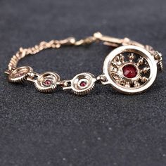 Turkish jewelry red stone charm bangle with crystal insert accents in ancient gold color. An old world design that adds character and flair to any outfit. Details Item Type: Fashion Bracelets Metal Type: Copper,Brass Plating: Gold Material: Resin,Crystal Length: 17.5+6.5cm Adjustable Red Formal Jewelry, Adjustable Ruby Bracelets For Formal Occasions, Elegant Red Chain Bracelet For Gift, Adjustable Ruby Bracelet For Formal Occasions, Formal Adjustable Ruby Bracelets, Red Adjustable Beaded Bracelets For Formal Occasion, Red Adjustable Beaded Bracelets For Formal Wear, Adjustable Ruby Bracelets Gift, Elegant Red Chain Bracelet With Jubilee Design