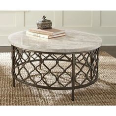 a table with a book on top of it in front of a white paneled wall