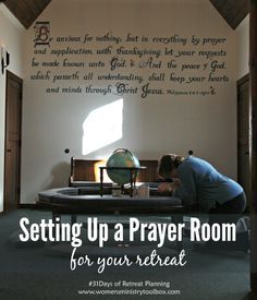 a woman sitting at a table in front of a wall with writing on it and the words setting up a prayer room for your next