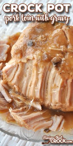 crock pot pork with gravy on a glass plate