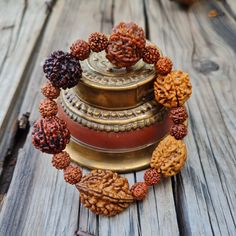 📿This unique bracelet is made from genuine sacred seeds of 2- 7 Mukhi Rudraksha. Wear this wrist seed bracelet to reap its amazing benefits.📿 2 Mukhi Rudraksha - It is also beneficial for those who are in search of the best life partner. It also helps to bring pleasure and spiritual gains to the wearer life. 3 Mukhi Rudraksha - Three Mukhi rudraksha has a soothing effect on one's mind and body. Three Mukhi Rudraksha is the form of three types of Agni (fire) and also the symbol of Three Deva i. Adjustable Spiritual Bracelets For Festivals, Spiritual Wooden Beads Stretch Bracelet For Healing, Adjustable Bracelets For Meditation And Festivals, Adjustable Brown Bracelet For Festivals, Spiritual Stretch Bracelet With Wooden Beads For Meditation, Spiritual Wooden Beads Stretch Bracelet For Meditation, Handmade Spiritual Wristband For Festivals, Adjustable Brown Bracelets For Festivals, Spiritual Handmade Wristband For Festivals