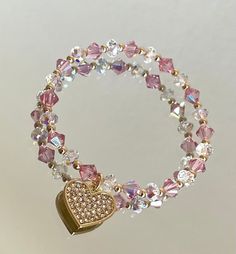 Made with 6mm pink high end crystals and 6mm clear ab swarovski crystal rondelle. Such a stunning piece for any occasion. Cheap Crystal Bracelet With Heart Beads For Women, Cheap Pink Crystal Bracelets, Cheap Crystal Heart Beads Bracelet As Gift, Cheap Pink Chain Bracelet For Gift, Cheap Pink Romantic Beaded Bracelets, Elegant Luxury Pink Beaded Bracelets, Pink Crystal Beaded Round Bracelets, Pink Crystal Bracelet With Rhinestones, Adjustable Pink Crystal Bracelet With Sparkling Stones