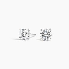 Claw Prong Round Diamond Stud Earrings. A beautifully matched pair of round diamonds are secured in an elegant, open basket with claw prongs. Earrings with a total carat weight of 1.00 carat or over will receive a guardian backing and earrings with a total carat weight under 1.00 carat will receive a push backing. Round Diamond Stud Earrings, Round Cut Diamond Earrings, Diamond Earrings Studs Round, Claw Prong, Diamond Stud Earrings, Diamond Stud, Accessories Jewelry Earrings, 3 Carat, 2 Carat