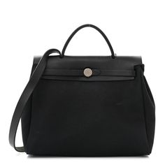 This is an authentic HERMES Toile Vache Calfskin Herbag 30 PM in Black. This stylish bag is crafted of black toile canvas in two different sizes that can be interchanged. The bag features a black leather crest with leather top handles and palladium silver hardware. High-end Coated Canvas Evening Bags, High-end Black Satchel With Removable Pouch, High-end Black Satchel Shoulder Bag, High-end Coated Canvas Satchel With Top Handle, Luxury Canvas Satchel With Removable Pouch, Designer Canvas Bag With Detachable Handle For Travel, Luxury Black Rectangular Canvas Bag, Luxury Canvas Bag With Top Handle, High-end Black Satchel With Detachable Handle