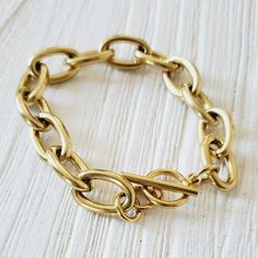 This Golden bracelet with the OT clasp is a versatile minimalist piece that goes with any look. This chunky link chain can be worn with another bracelets to create an arm party or you can wear it alone. You can also linked this bracelet with another OT clasp bracelet to wear them as a choker or link this bracelet with a choker for a longer length. Bracelet Details: Material: 18K Gold Plated & Stainless Steel Length: 6.5' Inch and you can add 2 inches with the extender Thickness: 8mm Quantity: 1 Trendy Chunky Link Chain Bracelet, Modern Link Chain Bracelet With Chunky Chain, Chic Chunky Chain Paperclip Bracelet With Oval Links, Chic Paperclip Bracelet With Chunky Oval Links, Chunky Elegant Bracelet For Everyday, Modern Bracelets With Chunky Link Chain, Modern Chunky Chain Paperclip Bracelet For Everyday, Modern Chunky Chain Link Bracelet, Everyday Chunky Chain Link Bracelet