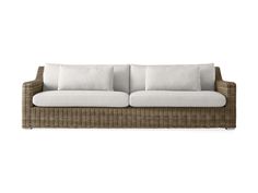 a wicker couch with white pillows on it's back and side cushions in the front