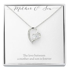 Give a loving gift that will make her heart melt! This dazzling Forever Love Necklace features a polished heart pendant surrounding a flawless 6.5mm cubic zirconia, embellished with smaller crystals adding extra sparkle and shine. The pendant is crafted in your choice of 14K white gold finish or 18K yellow gold finish, and dangles from an adjustable cable chain secured with a lobster clasp.Product Details:• 14K white gold finish or 18K yellow gold finish• Adjustable cable chain 18" - 22"• 6.5mm Mother's Day Anniversary Jewelry With Diamond Accents, Personalized Heart Necklace In Cubic Zirconia For Wedding, Personalized Cubic Zirconia Heart Necklace For Wedding, Diamond Heart Necklace For Wedding And Mother's Day, Diamond Accented Jewelry For Anniversary On Mother's Day, White Cubic Zirconia Heart Necklace For Mother's Day, Cubic Zirconia Heart Necklace With Birthstone For Anniversary, Round Birthstone Necklace For Wedding And Mother's Day, Diamond Cut Jewelry For Anniversary And Mother's Day