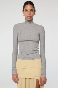 Blixa Turtleneck - Heather Grey | The Line by K Fall Long Sleeve Elastane Turtleneck, Fall Turtleneck Long Sleeve Top With Thumbholes, Long Sleeve Elastane Turtleneck For Layering, Chic High Neck Fitted Long Sleeve Top, Trendy Fitted Turtleneck For Spring, Stretch Turtleneck Long Sleeve Top In Elastane, High Neck Turtleneck With Thumbholes For Layering, Stretch Turtleneck Long Sleeve Top, Stretch Elastane Turtleneck Long Sleeve Top