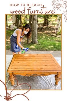 a woman sanding up a table with a cloth on it and the words how to bleach wooden furniture