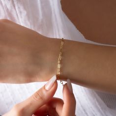 "14K Gold Paperclip Bracelet, Bold Link, Staple Chain, Rectangle Link, Elongated Link, Layering Chain, Mother's Day, Jewelry Gift Our product weighs 2.81 gr and the chain length is 17 cm. All of our products has the stamp \"585\" on them. (which states that this is real gold) Your products will be shipped with free shipping UPS express within 1-3 business days. Bracelet Size; o6 Inch: 15.20cm o6.5 Inch: 16.50cm o7 Inch: 17.80cm o7.5 Inch: 19.05cm o8 Inch: 20.30cm There may be +/- 0.15 change in Elegant Chain Bracelet With Rectangular Links As Gift, Elegant Chain Bracelet With Rectangular Links For Gift, Elegant Paperclip Bracelets As Gifts, Box Chain Bracelets With Rectangular Links, Modern Cable Chain Bracelet Gift, Modern Cable Chain Bracelet As Gift, Gold Rectangular Paperclip Bracelet With Adjustable Chain, Elegant Gold Paperclip Bracelet As A Gift, Modern Chain Link Gold Bracelet Gift