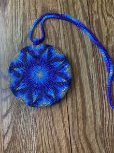 A traditional beaded star medallion in blue and purple. The medallion is on a beaded ombré chain and measures 4.5in diameter and the total necklace is 18in length. Beaded Pendant, Chain Styles, Bead Work, Blue And Purple, Necklace Lengths, Beaded Necklace, Handmade Items, Jewelry Necklaces, Stars