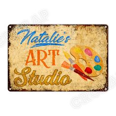 a metal sign that says natalie's art studio with paintbrushes and palettes