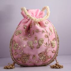 artisian handmade flower texture zardosi boho embroidered wedding potli bag handbag | beautiful bridemaids gifting handbag Designed with the heart, this beautiful Potli or batawa bag are eye catchy and made of premium material. Key Features: Embroidery art work This potli is good match with both Indian and western outfits and are superb for wedding and festive parties This would be best complement to your designer saree, lenhga or any other kind of dress This is the combination of traditional an Bohemian Potli Bag For Receptions And Festivals, Bohemian Embroidered Bags For Reception, Bollywood Style Handwork Bags For Reception, Bollywood Style Bags With Handwork For Reception, Zari Work Potli Bag For Festivals And Reception, Traditional Potli Bag With Dori Work For Reception, Gold Potli Bag With Dori Work For Reception, Festival Reception Potli Bag With Zari Work, Bollywood Style Potli Bag With Dori Work For Reception