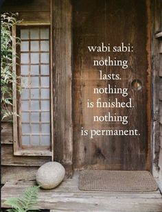 a wooden door with a quote on it that says, wabi sabi nothing last, nothing is finished nothing is permanent