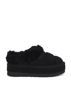 Find UGG Tazzlita Slipper on Editorialist. UGG Tazzlita Slipper in Black Quilted suede upper with rubber lug sole. Made in Vietnam Fur origin: Australia. Pull-on styling. Faux fur lining Dyed lamb collar. Uggplush ™ vamp lining and sockliner. Round toe. Water repellent. Approx 45mm/ 1.75 inch platform. UGGF-WZ67. 1146390. About the designer: Ugg Tazzlita, Kappa Slides, Chunky Slippers, Month Workout, Pretty Shoes Sneakers, Black Uggs, Shoe Wishlist, Uggs Outfit, Winter Fit