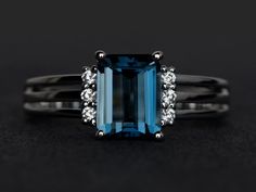 Welcome to my shop, you can find many beautiful gemstone jewelry here, and you also can ask for customized service. Main Stone: London blue topaz, emerald cut, measures 6X8mm, weight  about 2.0 caratsAccent Stones: czMetal: 925 sterling silver plated with rhodium. I also can provide metal options such as 14k solid yellow/white/rose goldSetting: four claw basket settingMore rings: https://www.etsy.com/shop/XCjewelryStudio?ref=hdr_shop_menuIt's a perfect gift for the person who was born in Novembe Blue Topaz Ring Engagement, Topaz Ring Engagement, London Blue Topaz Jewelry, Blue Topaz Ring Silver, Engagement Ring Blue, Blue Gemstone Ring, November Birthstone Ring, Blue Engagement Ring, Blue Topaz Engagement Ring