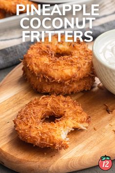 two pineapple coconut fritters on a cutting board