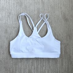 Never Worn, Alo White Sports Bra In Xs, Selling Because It’s Too Small For Me Now. I Got Pregnant And Never Got The Chance To Wear It! Alo Yoga Light Support Activewear For Gym, Alo Yoga Sports Activewear With Light Support, Cotton Gym Activewear With Built-in Bra, Cotton Athleisure Sports Bra With Built-in Bra, Alo Yoga Athletic Fit Activewear For Sports, Alo Yoga Breathable Activewear For Workout, Alo Yoga Sports Activewear, Sporty Bra-friendly Activewear By Alo Yoga, Alo Yoga Athleisure Sports Bra With Light Support