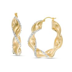 From the Diamond Fascination™ Collection, these striking twist hoop earrings add drama to your wardrobe. Fashioned in 14K gold over a resin core, each 30.0mm hoop is a chic sculpted 5.0mm-wide ribbon edged with diamond enamel pavé. Diamond Fascination™ jewelry shimmers with a diamond accent and a pavé of diamond dust crystallized into enamel - a patented handmade process that results in a high-end look. Buffed to a brilliant luster, these earrings secure with latch backs. Modern Twist Hoop Earrings For Anniversary, Jewel Drawing, Twisted Ribbons, Twist Hoop Earrings, Ribbon Jewelry, Jewelry Design Drawing, Diamond Dust, Buying Diamonds, Girly Jewelry