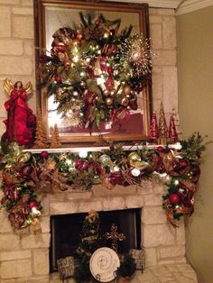 a fireplace decorated for christmas with wreaths and ornaments on it's mantel