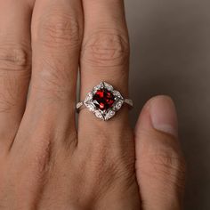 This is a gorgeous handmade creation. Its beauty is its simplicity & Elegance. The 7*7 mm cushion shape faceted natural garnet is crafted in solid sterling silver and with rhodium plated. All item is sent in a beautiful gift box If you have any idea of design your ring,pls contact me directly. You can realize more lovely stuff clicking the link https://www.etsy.com/shop/knightjewelry?refshopsection_shophome_leftnav Please leave the correct address and you phone number for delivering successf Garnet Wedding Rings, Red Gems, January Birthstone Rings, Garnet Engagement Ring, Red Garnet Ring, Ring Cushion, Cushion Cut Ring, January Birthstone, Garnet Ring