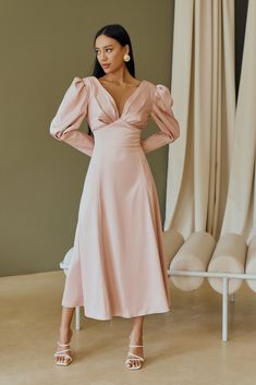 Fabric: Heavy Satin Cotton 50%, Polyester 50% V-neck dress Puffed sleeves Long sleeves Bow on back detail Zipper on back Dress lenght: 125 cm/ 49,2 inSleeve length: 68 cm/ 26,7 in Colors: White, Sky-Blue, Dusty Pink Chic V-neck Dress With Elastic Sleeves, V-neck Dress With Elastic Sleeves For Brunch, Chic Dresses With Structured Shoulders And Lantern Sleeves, Chic Knee-length V-neck Dress With Gathered Sleeves, V-neck Maxi Dress With Gathered Sleeves For Brunch, Elegant V-neck Midi Dress With Elastic Sleeves, Elegant Fitted V-neck Dress For Brunch, Long Sleeve Ruched Midi Dress With Fitted Bodice, Ruched Long Sleeve Midi Dress With Fitted Bodice