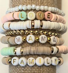 "Custom Word Heishi Stack Bracelets / Pastel Beaded Heishi Bracelets \"MAMA...LOVE...FAMILY\" Fun! Trendy! So Pretty! *Listing includes one bracelet *Option to choose 1 or more bracelets *Let me know your choice of 7 bracelets (A,B,C,D,E,F,Gold) in the Note to Seller box at checkout. *Customize by choosing Words to replace \"MaMa\", \"Family\", \"Love\" in the personalization box. If no words chosen you will receive the default words shown. *Placed in a burlap drawstring bag (or a gift box White Charm Bracelet With Colorful Beads For Jewelry Making, Adjustable Pastel Beaded Bracelet, Adjustable Bohemian Beaded Bracelets For Birthdays, Bohemian Style Adjustable Beaded Bracelets For Birthdays, Multicolor Bracelets For Mother's Day, Adjustable Heishi Beaded Bracelets For Birthday, Adjustable Heishi Beads Bracelet For Birthday, Heart Beaded Bracelets For Mother's Day, Green Round Beads Bracelets For Mother's Day