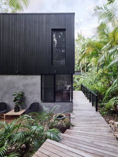 the house is surrounded by trees and plants