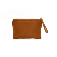 The Grab and Go Clutch is the perfect solution for an on-the-run, fast-paced lifestyle. With two outside pockets for your phone and keys, all you need is to toss in your essentials and you're ready for the busy day ahead!Handcrafted in full-grain leather and solid brass hardware with outside flat pockets, zipper closure, and inside zipper pocket with a built-in wallet.Ways To Wear Use it as a wallet or a clutch The perfect size for an iPad mini, cell phone, keys, and 6 credit cards. Details Zipp Modern Pouch Phone Bag For On-the-go, Modern Phone Bag Pouch For On-the-go, Brown Clutch For Everyday Use, Everyday Phone Bag With Cell Phone Pocket, Modern Pouch With Cell Phone Pocket For On-the-go, Modern Everyday Mobile Phone Pouch, Modern Mobile Phone Pouch For On-the-go, Brown Bag With Hidden Phone Sleeve For On-the-go, Rectangular Everyday Zipper Phone Bag