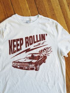 Keep rollin' with it. Our newest collection of graphic tees! With distressed, vintage style prints, these are your new go-to wardrobe staple. #graphictee #vintagetshirt #graphictshirt Retro T-shirt With Front Print For Fans, Retro Tri-blend T-shirt For Streetwear, Tri-blend Retro T-shirt For Streetwear, Relaxed Fit Graphic Tee With Vintage Print, Retro Fan Merchandise T-shirt With Front Print, White Vintage Print T-shirt With Relaxed Fit, White Vintage Print T-shirt Relaxed Fit, Retro Tri-blend T-shirt With Front Print, Vintage Screen Print T-shirt