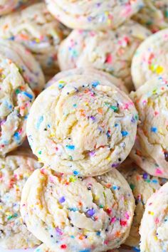 sprinkled cookies are piled on top of each other