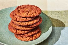 a stack of cookies sitting on top of a blue plate