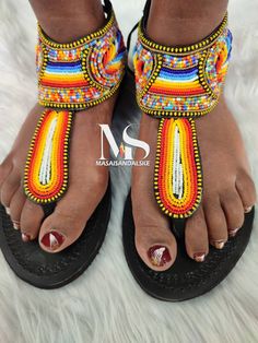 100% handmade using leather and fine beads. Masai beaded sandals are made using the pure original leather and quality African beads.They are inspired by the Masai community They are perfect for any occasion. True to size. We ship worldwide. Feel free to send me a convo for any clarifications Traditional Beaded Toe Post Flip Flops, Artisan Handmade Multicolor Sandals, Beaded Adjustable T-strap Sandals, Traditional Multicolor Beaded Flip Flops, Traditional Beaded Flip Flops With Round Toe, Traditional Beaded Flip Flops For Festivals, Traditional T-strap Sandals For Vacation, Artisan Handmade Toe Ring Sandals For Beach, Traditional T-strap Sandals With Single Toe Strap For Vacation