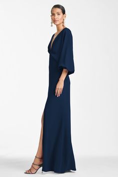 Shop the Gabby Gown in Navy at Sachin & Babi. FREE Shipping Over $500 & FREE Returns. Formal A-line Maxi Dress With Pleated Back, Chic Formal V-neck Gown, Classic A-line Maxi Dress For Formal Occasions, Evening V-neck Maxi Dress With Fitted Bodice, Formal Pre-draped Gown With Pleated Back, Elegant V-neck Evening Dress With Draped Sleeves, Formal Gown With Pleated Bodice, Pre-draped Maxi Cocktail Dress, Evening Gown With Draped Sleeves And Fitted Bodice