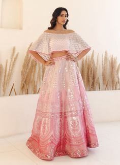 Step into the limelight with an enchanting Pastel Pink Off Shoulder Crop Top Lehenga set, a dazzling ensemble that combines modern flair with traditional elegance. Crafted from luxurious organza, the pink lehenga features stunning silver foil work and intricate sequins that shimmer with every movement. The high-waisted skirt showcases a gradient of pink hues, beautifully adorned with elaborate patterns that add depth and sophistication. Paired with an off-shoulder crop top embellished with delic Pastel Ghagra, Studio Iris, Blouse Organza, Top Lehenga, Lehenga Crop Top, Crop Top Lehenga, Dresses Traditional, Vacuum Storage, Pink Lehenga