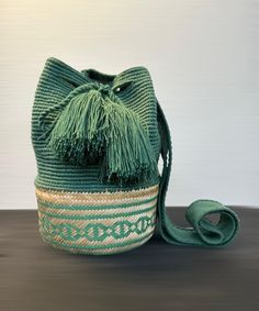 100% handmade, exclusive design. Emerald green Wayuu backpack Length 10 inches Handle that hangs on the shoulder 19 inches Width 12 inches Green Crossbody Backpack With Adjustable Strap, Green Bucket Bag Backpack For Daily Use, Green Bucket Bag With Adjustable Strap, Casual Green Crochet Bag With Adjustable Strap, Casual Green Straw Shoulder Bag, Green Casual Crossbody Backpack, Casual Green Crossbody Backpack, Green Crochet Bag With Adjustable Strap For Beach, Casual Green Bucket Bag For Travel