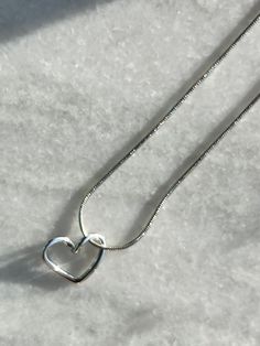 Fall in love with this gorgeous silver heart pendant necklace! The heart motif represents love in its many forms - romantic love, familial love, friendship, self-love. This necklace made with quality materials makes the perfect gift for any occasion! Pendant size:  L 0.59in W 0.71in Chain length: 18in Silver Dainty Heart Necklace, Silver Heart Pendant Necklace With Heart Detail, Silver Beaded Heart Pendant Necklace, Silver Necklace With Heart Detail, Dainty Silver Heart Necklace, Minimalist Sterling Silver Heart Necklace For Mom, Silver Heart Detail Necklace Gift, Silver Heart Detail Necklace For Gift, Sterling Silver Heart Beads Necklace For Her