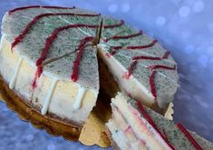 a cake with white frosting and red sprinkles