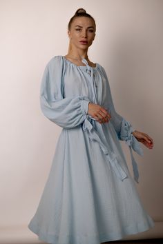 Indulge in timeless romance with our A-line midi dress featuring wide puffy sleeves, a captivating neckline, and a graceful long fabric belt. Crafted from soft cotton muslin, this enchanting piece is designed to elevate your elegance with every step. 💠 See other Products : https://www.etsy.com/de-en/shop/LuluComfort 📸 MODEL The model in the pictures is 164cm/5'3" tall and wears a size S; 📌 SIZES 💠 Available in a range of sizes to ensure the perfect fit for every body type: ➡️ XS: US 2 / UK 6 Spring Flowy Peasant Dress With Puff Sleeves, Spring Daywear Puff Sleeve Dress With Bishop Sleeves, Spring Puff Sleeve Dress With Bishop Sleeves For Daywear, Midi Dress With Bishop Elastic Sleeves, Midi Dress With Bishop Sleeves For Brunch, Brunch Midi Dress With Bishop Sleeves, Spring Long Sleeve Dress With Puff And Gathered Sleeves, Billowy Midi Dress With Lantern Sleeves, Spring Puff Sleeve Dress With Bishop Sleeves