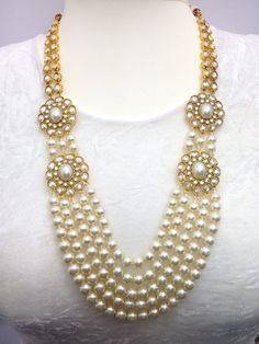 "Pearl and Cubic Zirconia Gold Plated Handmade Bridal Party Wear /Rani haar/ Anarkali Jewellery Set Necklace Earrings and Tika Wedding Jewellery 1-Necklace, 1-Pair Earrings, 1-Headpiece/Tika,  Earrings Length: 3.4\"inches  Necklace Length: 11.5\"inches  Item Code: WATI:9520-270 Traditional Indian Wedding Jewellery  Slight Colour variations possible due to difference in screen and photograph" Festive White Bridal Necklace For Party, White Necklaces For Diwali Party, Bollywood Style White Bridal Necklace For Party, White Bridal Necklace For Diwali Party, Pearl Bridal Necklace For Reception And Festivals, Pearl Bridal Necklace For Reception During Diwali, Pearl Bridal Necklace For Reception At Diwali, White Tikka For Eid Celebrations, White Pearl Chain Jewelry Set For Diwali