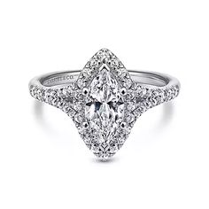 an 18k white gold pear shaped diamond engagement ring