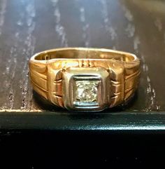 A 14kt yellow gold antique old European cut diamond ring.  Size 7 1/8. Diamond bead set in white gold.   Condition is good for its age-wear commensurate with age.  THE DIAMOND is an old EUROPEAN or miner cut diamond-the diamond faceting is good there is a bit of a typical inclusion(carbon)-not noticeable when worn only mentioned for accuracy.  It has a Deco styled shank with some wear from age but -smooth wear commensurate with its age.  Circa first half of the 1900s.  Easy statement ring to wea Vintage Oval Diamond Ring With Single Diamond, Vintage Oval Diamond Ring With Single Stone, Classic Diamond Signet Ring Collectible, Antique Signet Ring With Diamond For Anniversary, Collectible Classic Diamond Signet Ring, Vintage Signet Ring With Single Diamond For Formal Occasions, Antique Oval Single Diamond Ring, Vintage Oval Diamond Cut Signet Ring, Vintage Oval Signet Ring With Diamond Cut