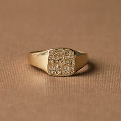 The Magic Sator Square Signet Ring is a testament to the mysterious intersection of language, numbers, and power. This unique piece of jewelry takes its inspiration from the enigmatic SATOR Square, a word puzzle first unearthed in the archaeological remnants of Pompeii, which dates back to at least 79CE. Celebrated British classical historian Donald Atkinson described the square as dwelling in the "mysterious region where religion, superstition, and magic meet, where words, numbers, and letters Symbolic Yellow Gold Rings For Ceremonial Occasions, Symbolic Engraved Rings For Ceremonial Occasion, Ceremonial 14k Gold Engraved Ring With Polished Finish, Symbolic Gold Signet Ring For Ceremonial Occasions, 14k Gold Symbolic Engraved Ring As A Gift, Timeless Gold Rings For Ceremonial Occasions, Symbolic Engraved Ring For Anniversary, Gold Symbolic Signet Ring For Ceremonial Occasions, Gold Symbolic Engraved Open Ring