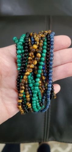 What a beautiful set of 4 beaded necklaces! It's 4 strands with removable gold clasp. They're 17 inches in length. They're versatile because they can be worn different ways; even one strand at a time. Cheap Multicolor Strand Jewelry, Affordable Vintage Multi-strand Beaded Necklaces, Black Lace Gloves, Semi Precious Necklace, Vintage Chain Necklace, Handmade Statement Necklace, Beaded Boho Necklace, Funky Necklace, Lace Gloves