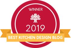 the winner badge for best kitchen design blog award is shown in red and gold with an orange ribbon around it